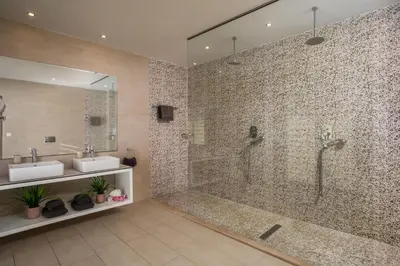 a bathroom with two sinks and a shower at Villa Lily in Pefki Rhodes