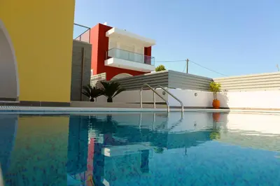 a house with a swimming pool in front of a house at Gennadi Aegean Horizon Villas in Gennadi