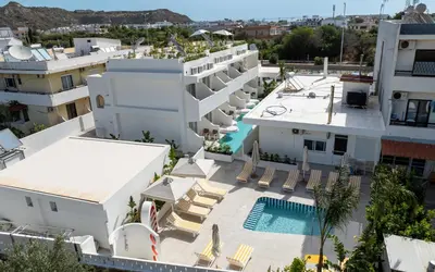 an aerial view of a building with a swimming pool at Patricia Suites in Faliraki