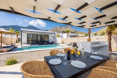 an image of a villa with a table and chairs at Villa 13 Zendo in Kolimbia