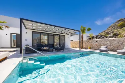 a swimming pool in the backyard of a villa at Villa 10 Hozan in Kolimbia