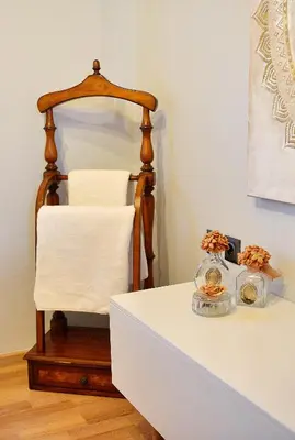 a table with a white counter top with a chair at Unique Smaragda's Residense in Rhodes Town