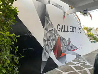 a mural on the side of a building at Gallery7B in Ialyssos