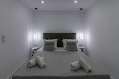 a bedroom with a large bed with two pillows at Melia Luxury Villa in Kolimbia