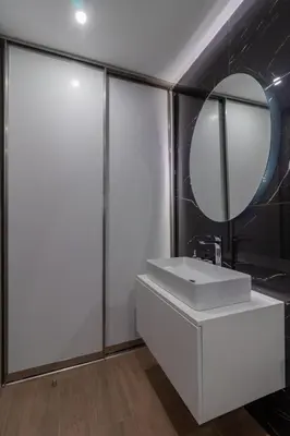 a bathroom with a white sink and a mirror at Melia Luxury Villa in Kolimbia