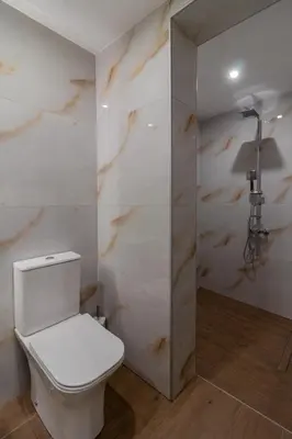 a bathroom with a toilet and a shower at Melia Luxury Villa in Kolimbia