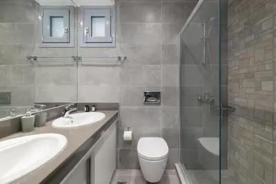 a bathroom with a toilet and a sink and a shower at Modern Luxury Villa in Rhodes Town