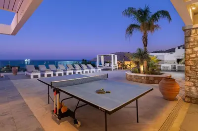 a ping pong table in the middle of a patio at Modern Luxury Villa in Rhodes Town