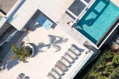 an overhead view of a swimming pool next to a house at Modern Luxury Villa in Rhodes Town