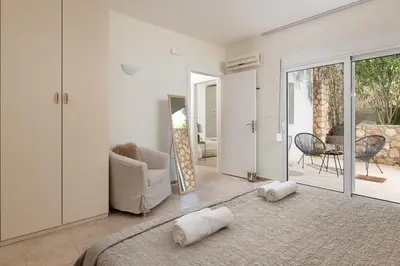 a living room with a couch and a chair at Villa Mare di Levante with Private Pool in Líndos