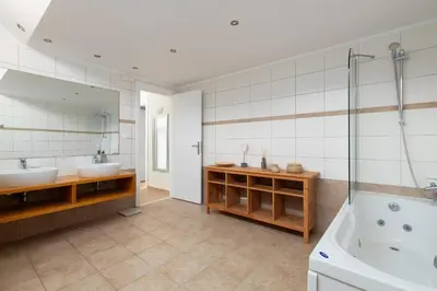 a bathroom with two sinks and a tub at Villa Mare di Levante with Private Pool in Líndos