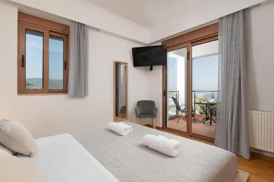 a bedroom with a bed with two white towels on it at Vitzi Vista Villa in Rhodes Town