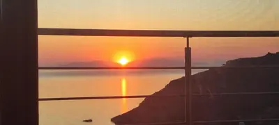 a view of a sunset from a window at Vitzi Vista Villa in Rhodes Town