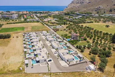 an aerial view of a parking lot with houses at Villa Zen Roshi by Villa Plus in Kolimbia