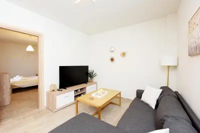 a living room with a couch and a television at Square home in Émbonas