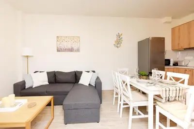 a living room with a couch and a table at Square home in Émbonas
