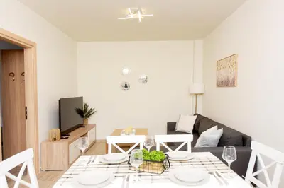 a living room with a table and a couch at Square home in Émbonas