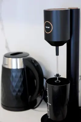 a coffee maker is sitting next to a coffee mug at Square home in Émbonas