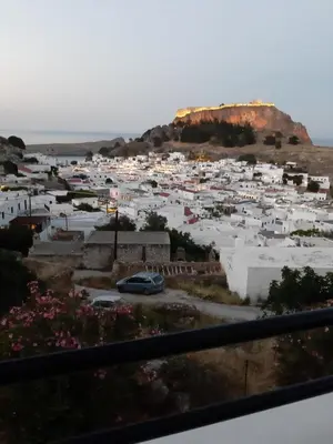 a town on a hill with white buildings at Chrysa Studios in Líndos