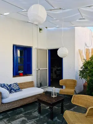 a living room with a couch and chairs and a table at Rhodes Summer House in Gennadi
