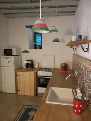 a kitchen with a sink and a stove at Rhodes Summer House in Gennadi