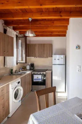 a kitchen with a stove and a dishwasher at Villa Elizabeth in Symi