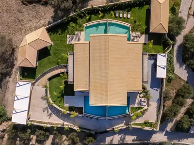 an aerial view of a house with a swimming pool at Olympus Luxury Villa Rhodes in Koskinou