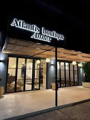 a building with a sign for an atiths boutique alliance at Atlantis Boutique ΑΝΝΕX in Rhodes Town
