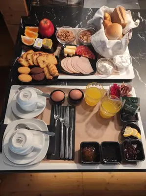 a table with two trays of food on it at Atlantis Boutique ΑΝΝΕX in Rhodes Town