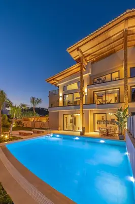 a large swimming pool in front of a house at Vadis Luxury Villa Rhodes in Koskinou