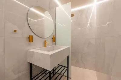 a white bathroom with a sink and a mirror at Tinas Lindian Serenity Villa in Líndos