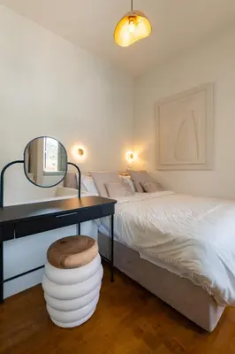 a bedroom with a bed and a table with a mirror at Tinas Lindian Serenity Villa in Líndos