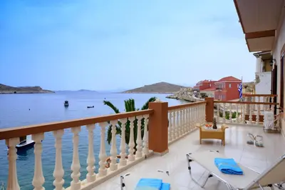 a balcony with a view of the water at Villa Skiadeni in Halki