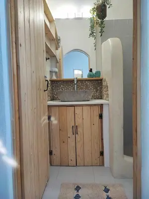 a bathroom with a sink and a mirror at Studio Lachania in Lachania