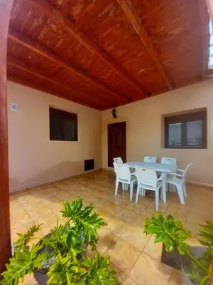 a dining room with a table and chairs in a room at Damian House in Afantou