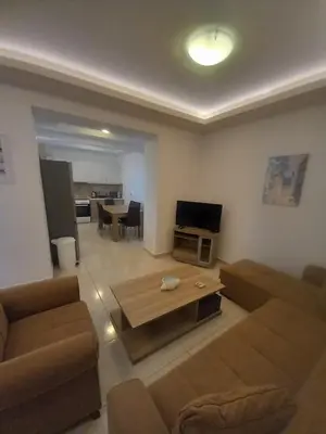 a living room with a couch and a coffee table at Damian House in Afantou