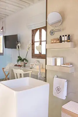 a bathroom with a sink and a mirror at Villa Panthea in Líndos