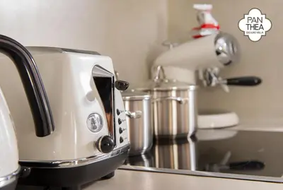 a white toaster sitting on top of a kitchen counter at Villa Panthea in Líndos