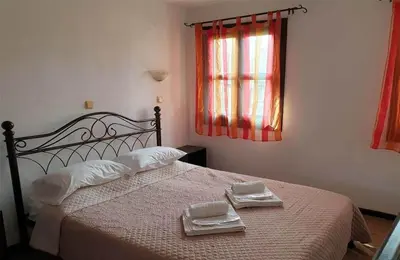 a bedroom with a bed with two towels on it at Saint Michel Apartments in Rhodes Town