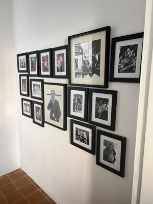 a bunch of pictures hanging on a wall at Old Town Retreat in Rhodes Town
