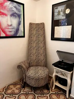 a chair sitting in a corner next to a desk at Old Town Retreat in Rhodes Town