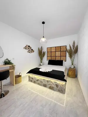 a bedroom with a bed and a desk in it at LA Casa Di Lusso Casa N8 Adults Only in Kolimbia