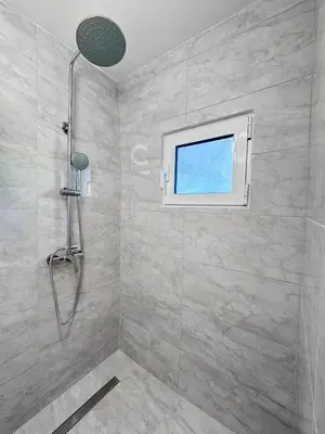 a bathroom with a shower and a window at LA Casa Di Lusso Casa N8 Adults Only in Kolimbia