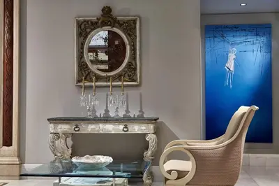 a dining room with a glass table and a mirror at Rodos Park in Rhodes Town