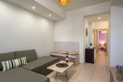 a living room with a couch and a table at Levanta Cozy Apartments in Kalavarda Rhodes in Rhodes Town