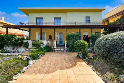 a house with a walkway in front of it at Levanta Cozy Apartments in Kalavarda Rhodes in Rhodes Town