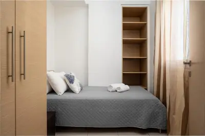 a bedroom with a bed with two towels at Levanta Cozy Apartments in Kalavarda Rhodes in Rhodes Town