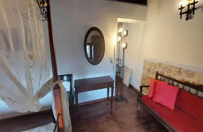 a bedroom with a bed and a table and a mirror at Saint Michel Collection - Old Town in Rhodes Town