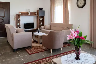 a living room with a couch and chairs and a table at Serenity Luxury Villa in Paradisi Rhodes in Rhodes Town