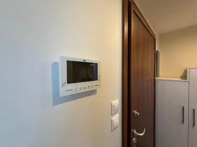 a tv on the wall of a room at Arfaras Home in Ixia